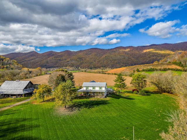 mountain view featuring a rural view