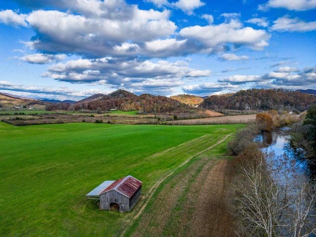 drone / aerial view featuring a rural view and a mountain view