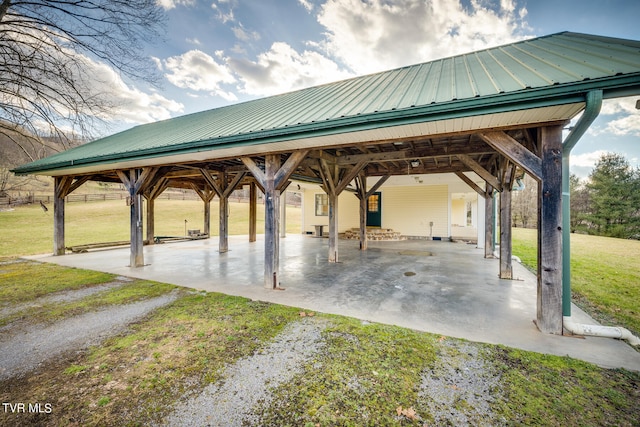 view of property's community featuring a lawn, a patio, and a gazebo