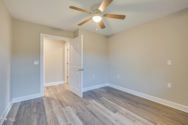 spare room with ceiling fan and light hardwood / wood-style floors