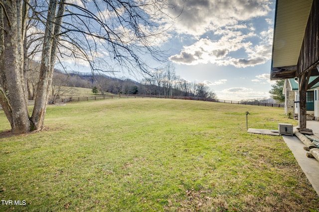 view of yard with a rural view