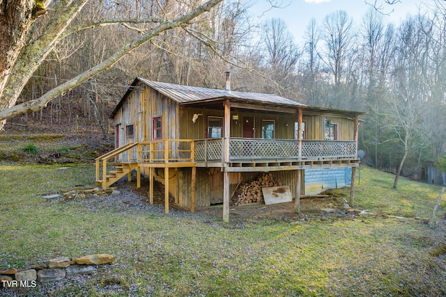 rear view of house with a lawn