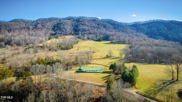 drone / aerial view featuring a mountain view and a rural view