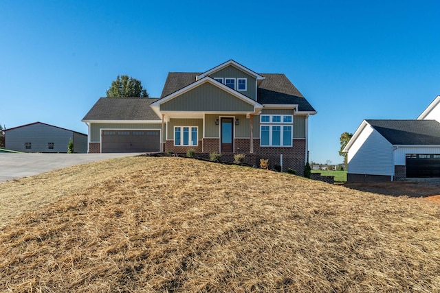 craftsman inspired home with a front lawn and a garage