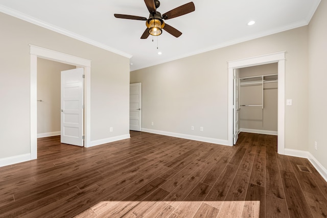 unfurnished bedroom featuring ceiling fan, a closet, dark hardwood / wood-style floors, and ornamental molding