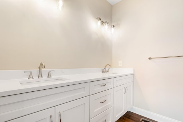 bathroom featuring wood-type flooring and vanity