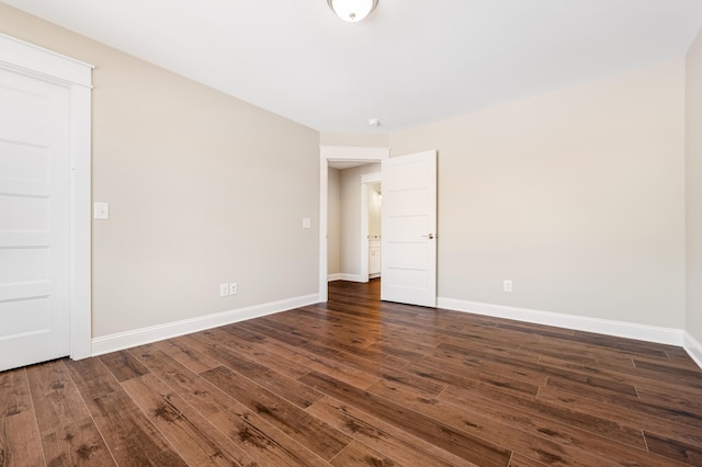 empty room featuring dark wood-type flooring