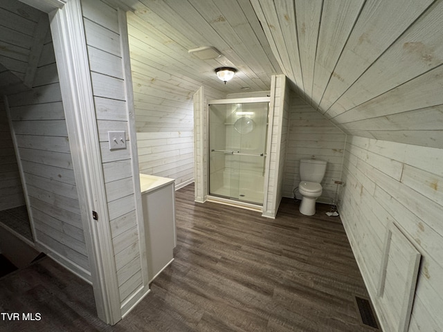 bathroom with visible vents, toilet, a stall shower, wood finished floors, and wood ceiling