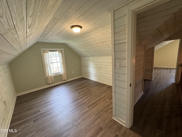 bonus room with lofted ceiling, wooden walls, wood ceiling, and dark wood-style floors