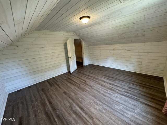 bonus room with lofted ceiling, wooden ceiling, and wooden walls