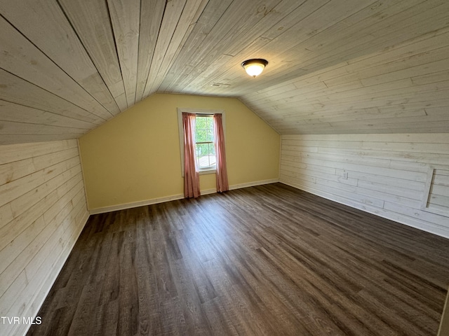 bonus room with lofted ceiling, wood ceiling, wood finished floors, and wood walls