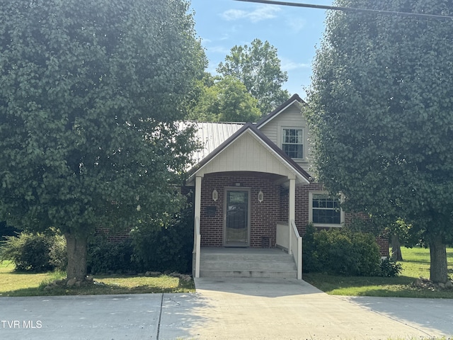 view of front of house featuring brick siding