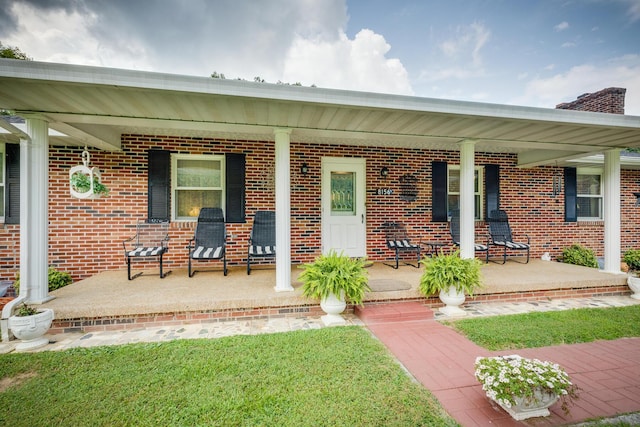 property entrance featuring covered porch