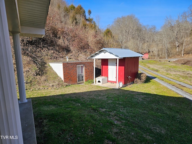 view of outdoor structure with a lawn