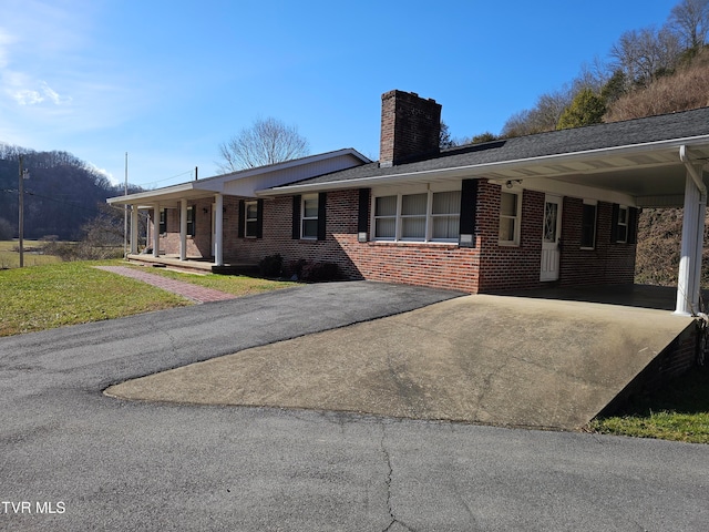 ranch-style home with a carport