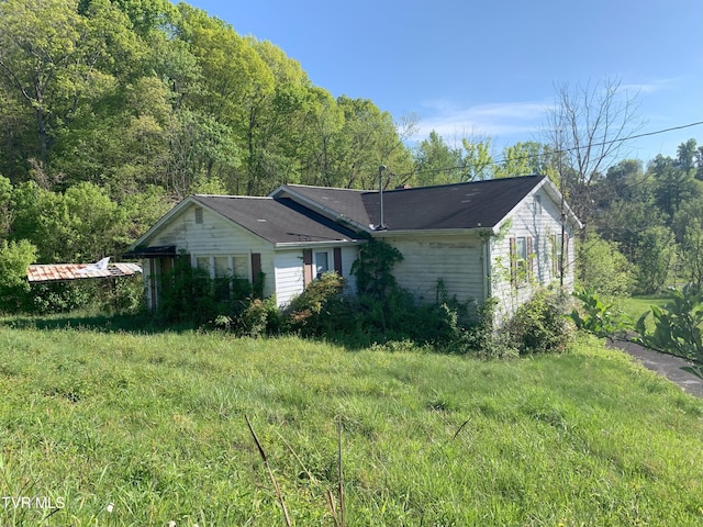 view of property exterior featuring a yard