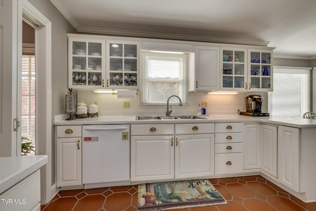 kitchen featuring sink, dark tile flooring, white cabinets, white dishwasher, and tasteful backsplash