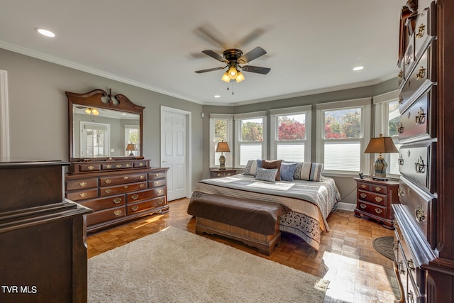 bedroom featuring light parquet flooring, ornamental molding, and ceiling fan