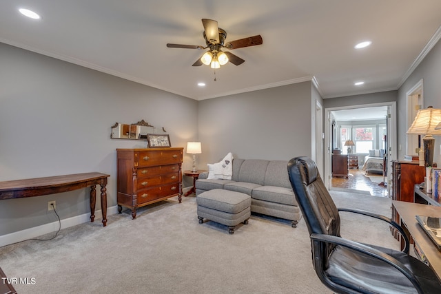 carpeted home office with ceiling fan and ornamental molding