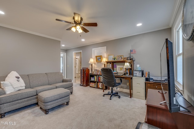 carpeted home office with crown molding and ceiling fan