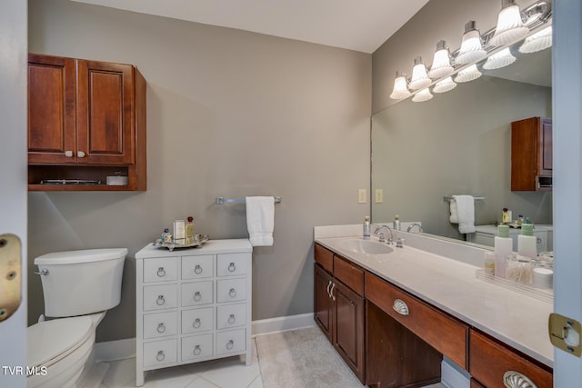 bathroom with tile flooring, oversized vanity, and toilet