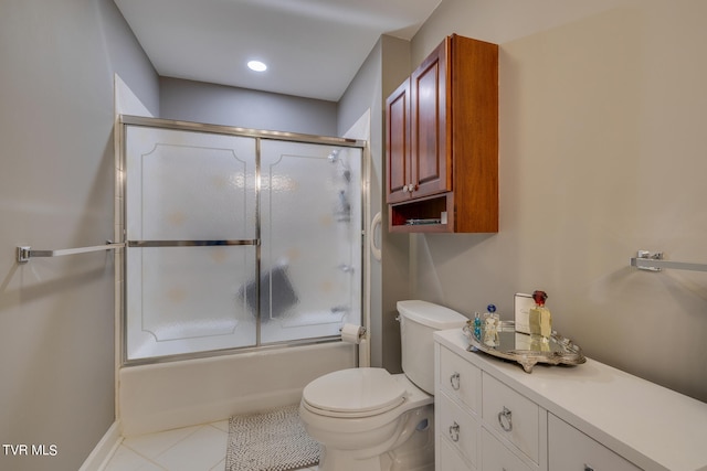 full bathroom featuring bath / shower combo with glass door, vanity, toilet, and tile floors