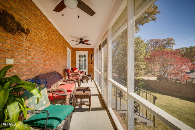 sunroom featuring ceiling fan