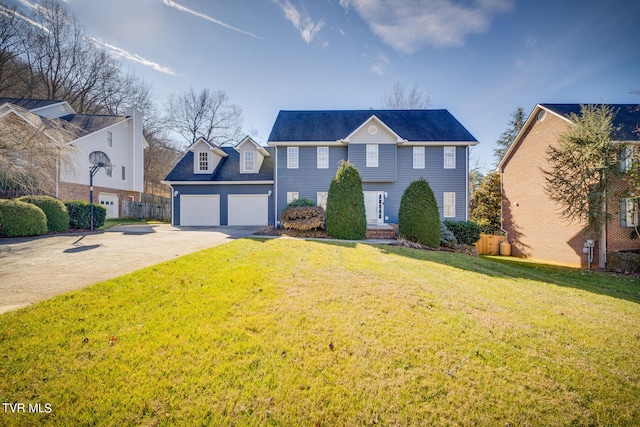 view of front of home featuring a front lawn and a garage