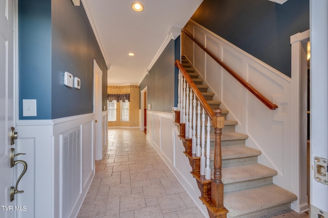 interior space featuring light tile patterned flooring and ornamental molding