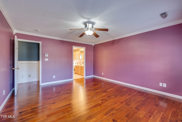 interior space with ceiling fan, hardwood / wood-style flooring, ornamental molding, and a textured ceiling