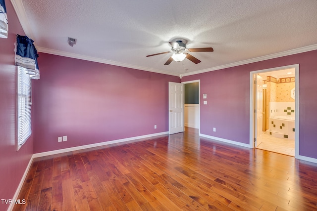 unfurnished room with a textured ceiling, ceiling fan, ornamental molding, and tile patterned floors