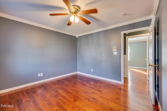 unfurnished room with ceiling fan, hardwood / wood-style flooring, and crown molding