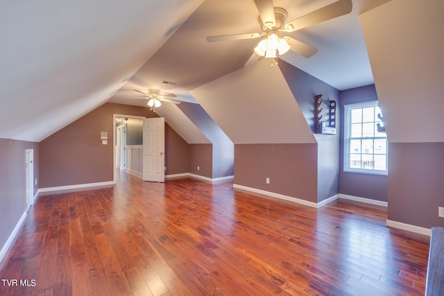 additional living space with ceiling fan, vaulted ceiling, and hardwood / wood-style flooring