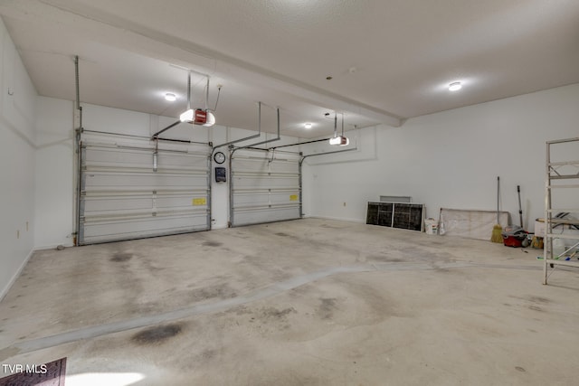 garage featuring a garage door opener