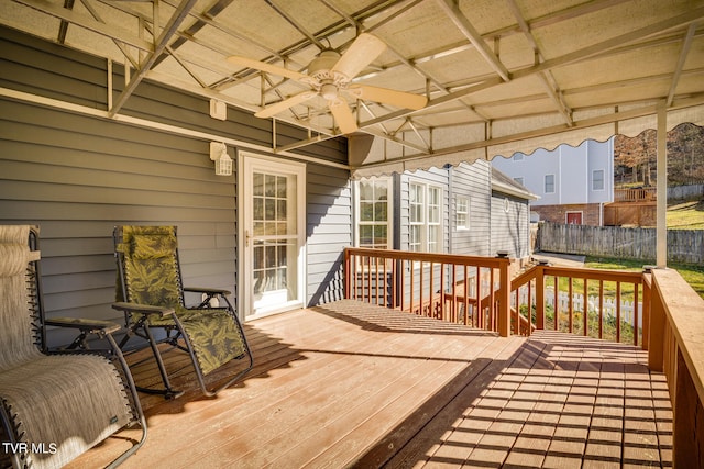 wooden deck featuring ceiling fan