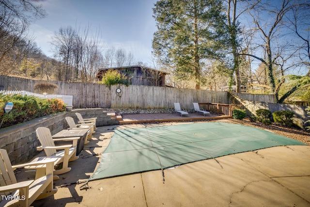 view of swimming pool featuring a patio