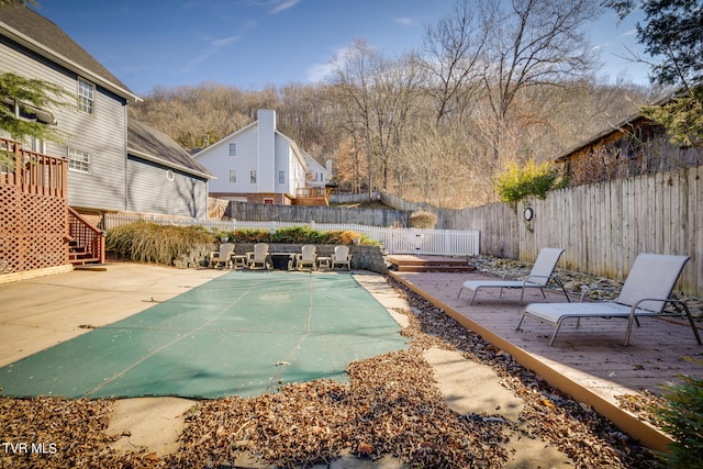 exterior space with a deck and a patio