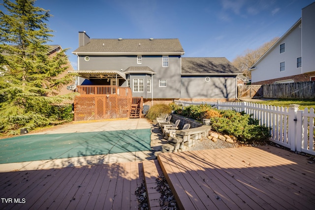 wooden terrace featuring a patio area