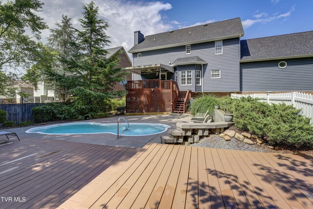 view of pool featuring a wooden deck