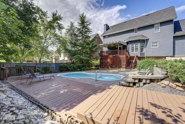 view of pool with a deck