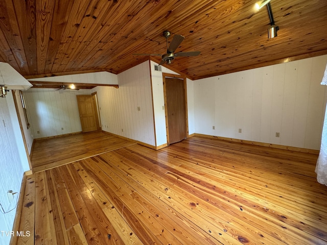 interior space featuring wooden walls, light hardwood / wood-style floors, lofted ceiling, and wood ceiling