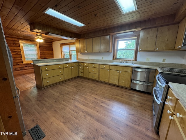 kitchen featuring sink, dark hardwood / wood-style flooring, wooden ceiling, and appliances with stainless steel finishes