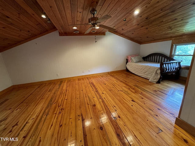 unfurnished bedroom with light hardwood / wood-style floors, lofted ceiling, and wood ceiling