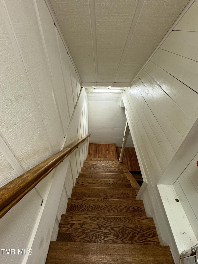 stairway featuring hardwood / wood-style flooring