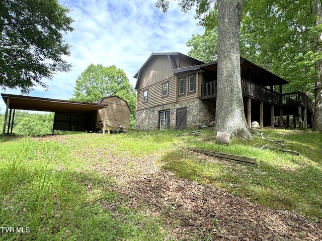 rear view of property featuring a shed