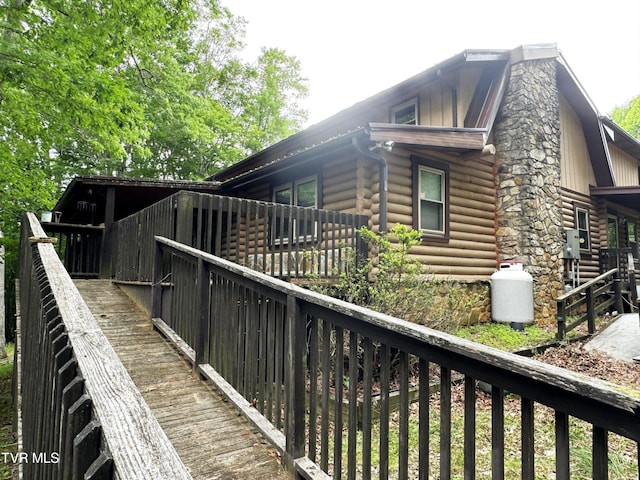 view of property exterior featuring a deck