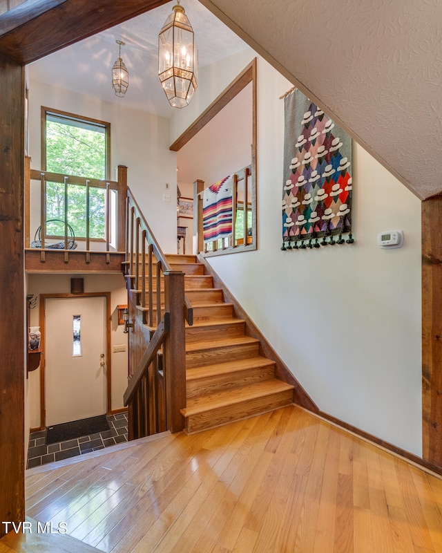 117 Lakeside Dr, Gray, TN 37615 - stairs featuring hardwood / wood-style flooring and a high ceiling