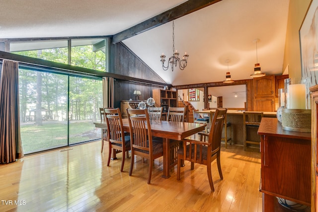 117 Lakeside Dr, Gray, TN 37615 - dining area featuring vaulted ceiling with beams, floor to ceiling windows, light hardwood / wood-style floors, and a notable chandelier