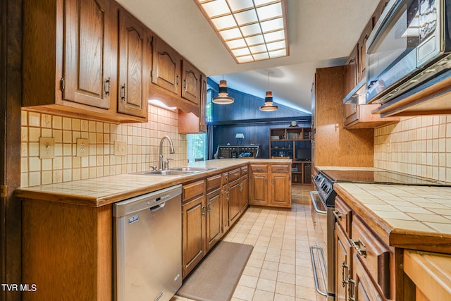 117 Lakeside Dr, Gray, TN 37615 - kitchen with sink, decorative backsplash, tile counters, and appliances with stainless steel finishes