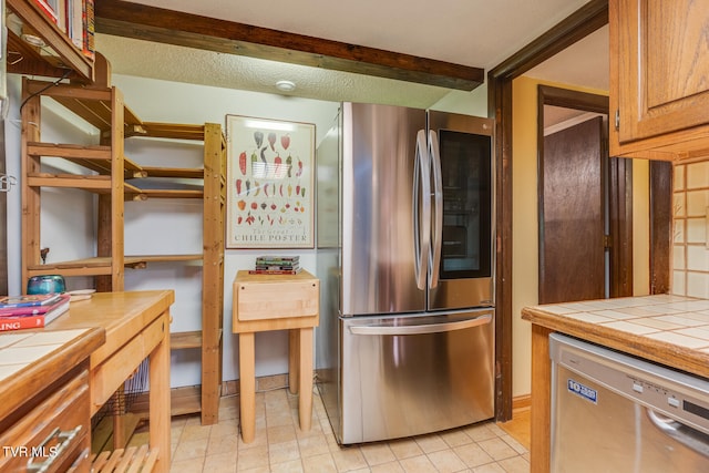 117 Lakeside Dr, Gray, TN 37615 - kitchen with appliances with stainless steel finishes, tile countertops, and a textured ceiling